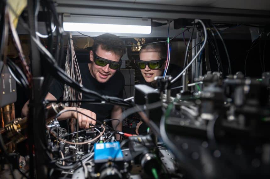 Dougal Main and Beth Nichol working on the distributed quantum computer. Credit John Cairns. RESIZED 0